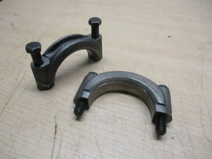 Cast iron bearing caps with studs