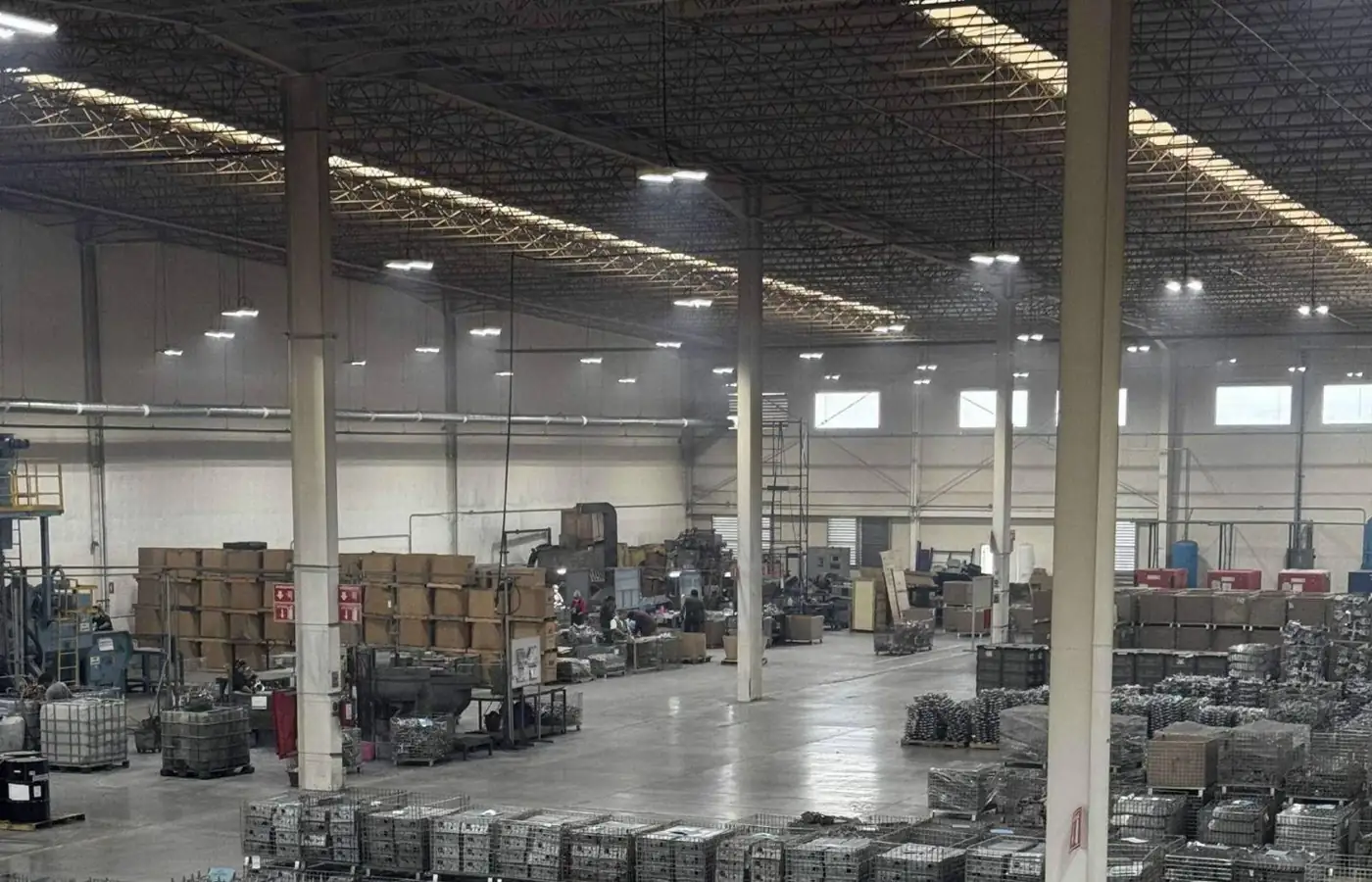 Aluminum die casting plant floor with finished parts in baskets