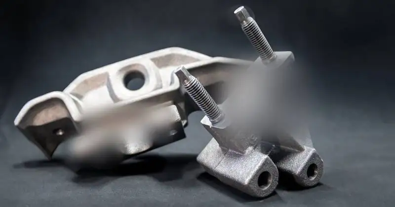 Bracket with studs, Ductile iron, machined, press fit
