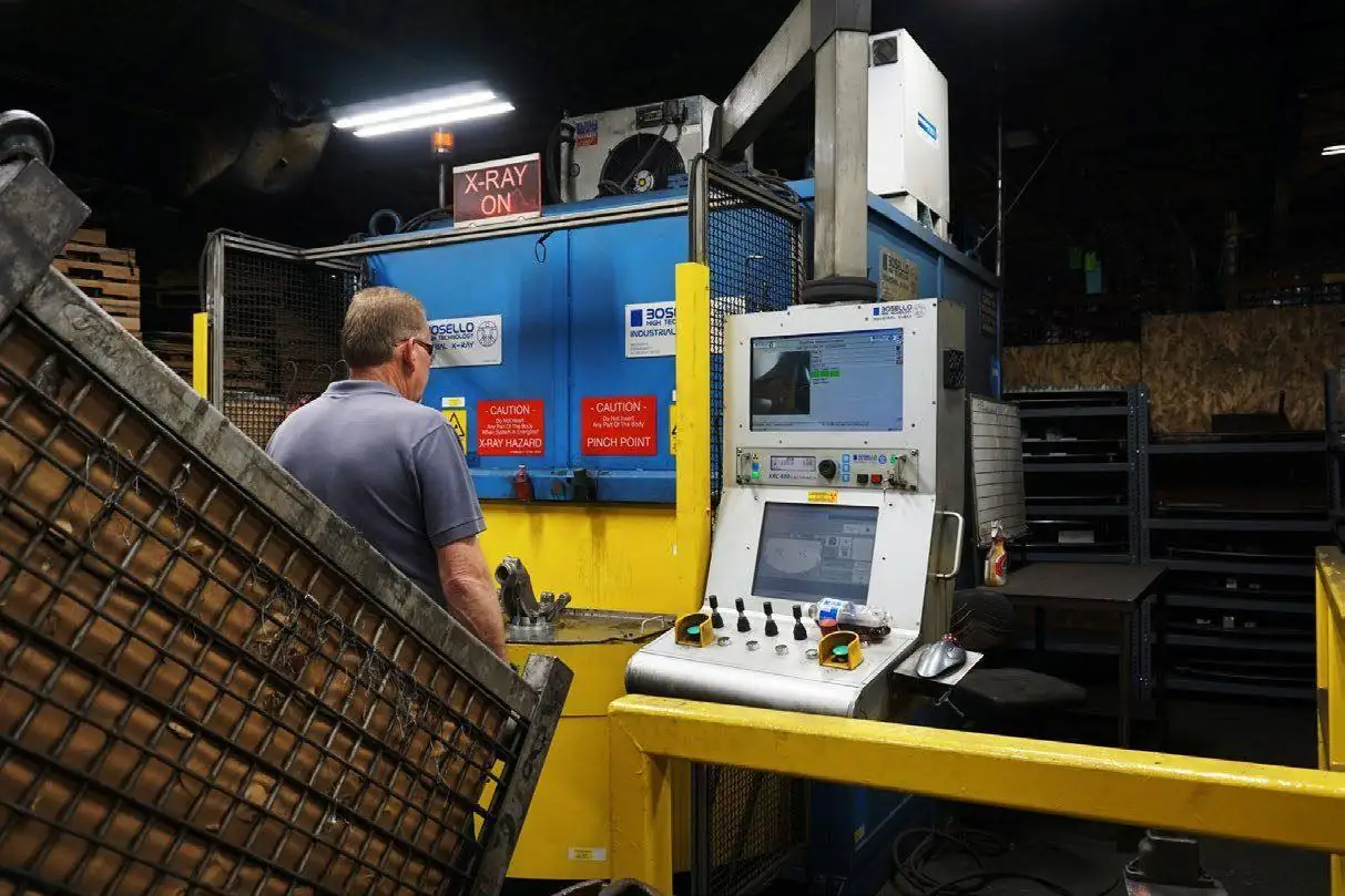Operator at a real-time X-ray inspection system for castings